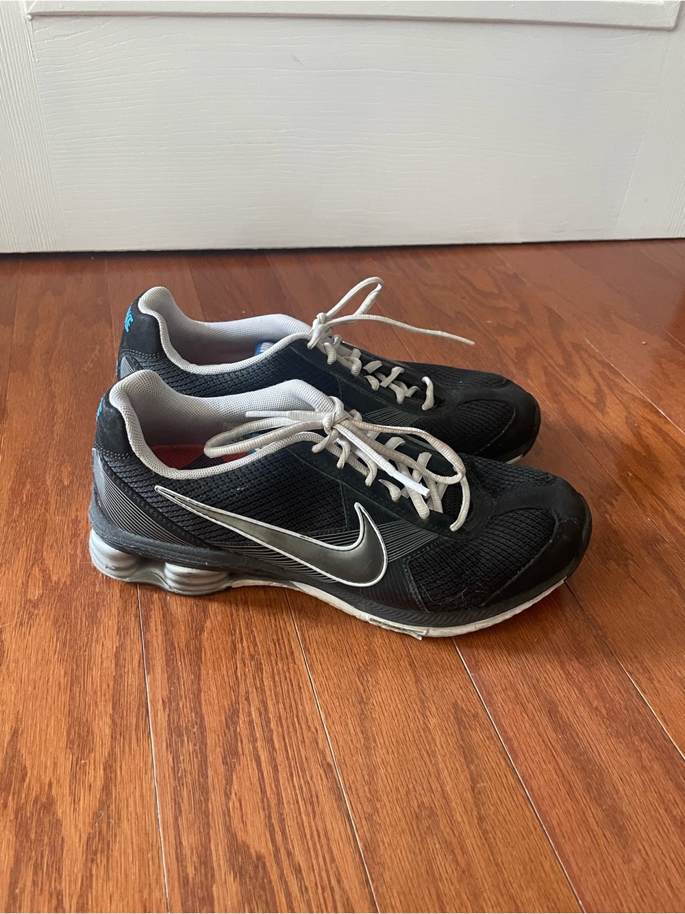 Nike Women’s Black Athletic Sneakers with Silver Swoosh